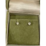 A pair of 18ct white gold diamond stud earrings, gh colour,