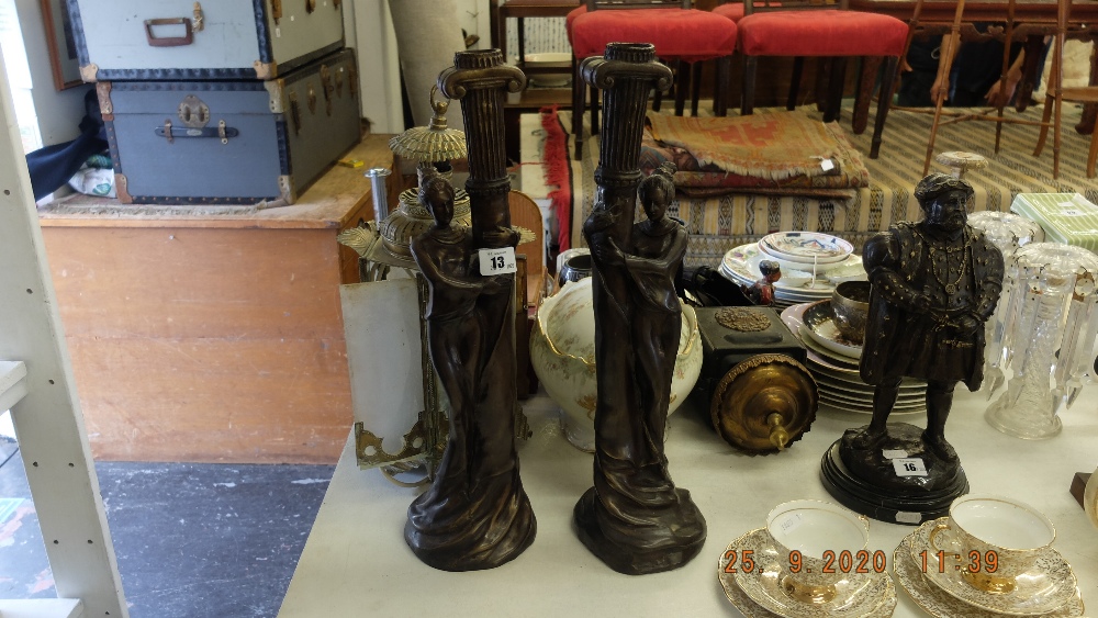 A pair of art deco style figural candle sticks