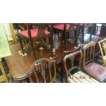 A 19th century mahogany extending table with three extra leaves 253cm x 131cm