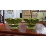 A pair of Shorter and Son green urns