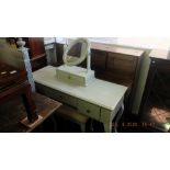 A contemporary dressing table and stool