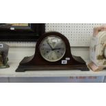 An Oak Napoleon hat clock