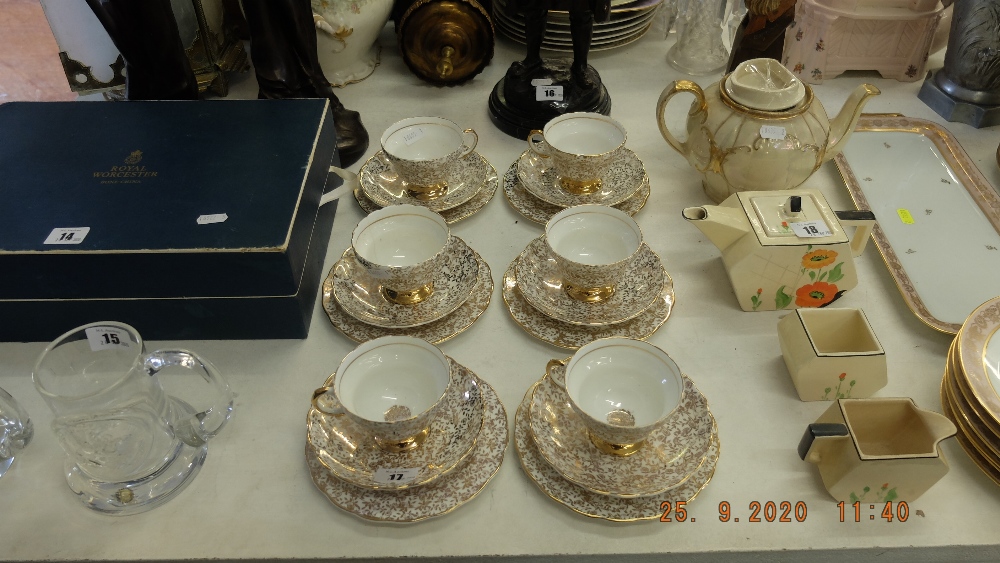 A six place Imperial bone china, white and gilt tea set, two cups a.