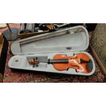 A cased violin and bow