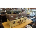 Two early suitcases and a brief case