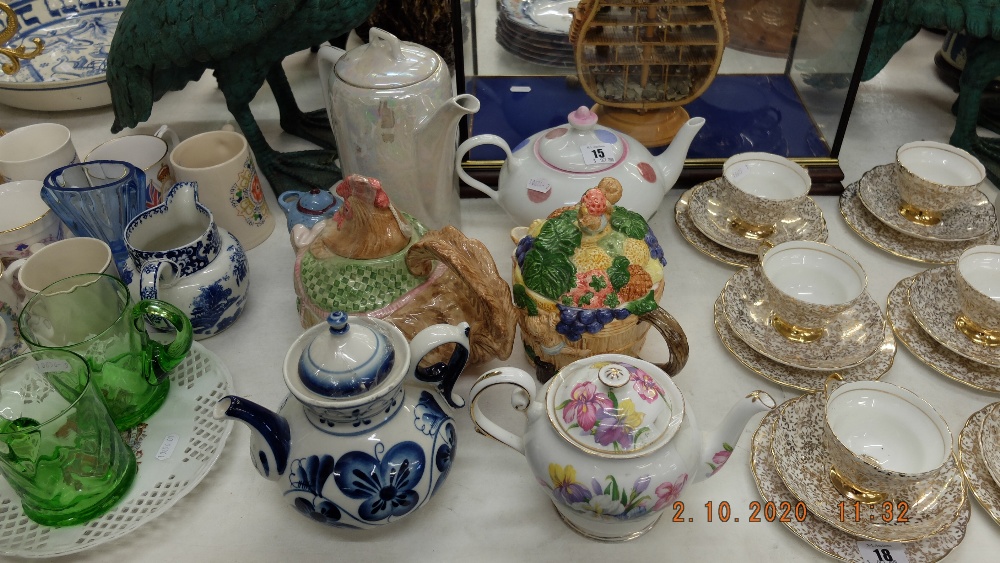 A collection of six teapots