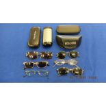 Eight pairs of assorted designer glasses/ sunglasses; Rayban, Polo etc.