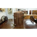 A vintage copper water storage drum