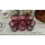 Six cranberry glass tumblers