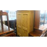 A 19th century pine double wardrobe.