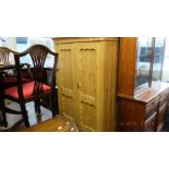 A 19th century pine double wardrobe.