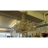 A six branch glass and metal 'Maria Theresa' chandelier,