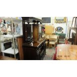 An Edwardian mahogany mirror back side board