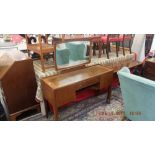 A mid century dressing table and stool