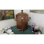 A vintage copper water storage drum