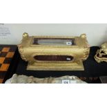 An oriental wooden and gilt casket,