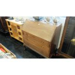 An oak bureau with three drawers