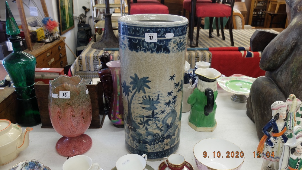 A blue and white oriental umbrella stand