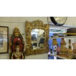 A gilt framed mirror