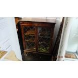 Glass fronted bookcase, with key a.