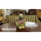 A colourful frog figure with lid,