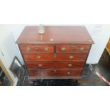 A mahogany two over three chest of drawers