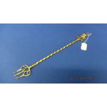 A brass toasting fork