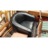 A black leather tub chair