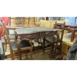 A mahogany leather top writing desk