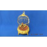 A decorative bird in cage