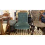 A petrol blue upholstered nursing chair