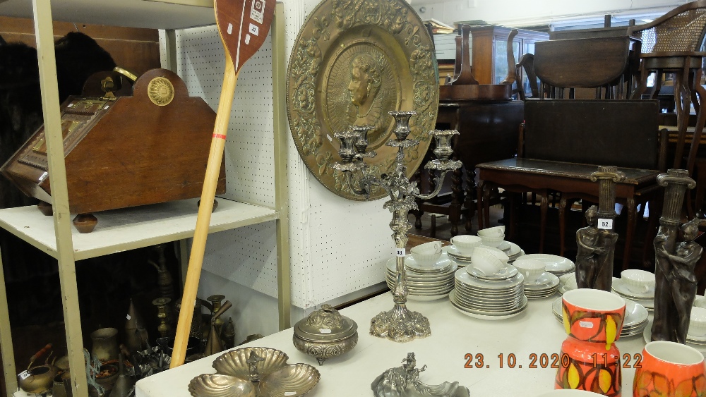 A large plated candlebra, dishes,