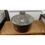 A copper lidded pot