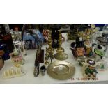 A collection of brass ware, candles and figures etc.