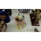 A colourful frog figure with lid,