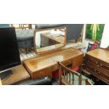 A mid century dressing table and stool