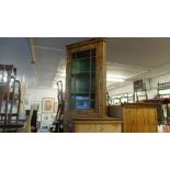 A walnut corner cabinet