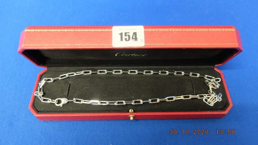 An 18ct white gold Cartier chain, 22 inches long,