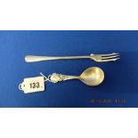 A continental silver caddy spoon and a hm silver pickle fork