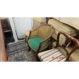 A mahogany carved tub chair on ball and claw feet