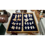 An early Chinese bone chess set, with Chinese figures,