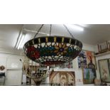 A hanging Tiffany style lamp shade fitting,