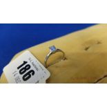 A HM 18ct white gold emerald cut diamond ring,