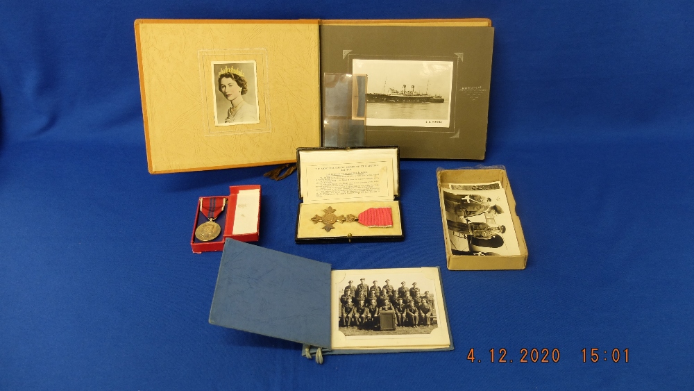 A collection of war memorabilia; OBE medal, Coronation medal, photographs inc Rommel and Montgomery,