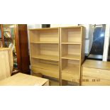 A John Lewis oak bookcase plus another