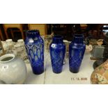Three blue cut glass vases