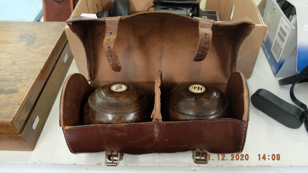 A set of bowls in leather carry case