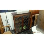 Glass fronted bookcase, with key a.