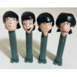 BEATLES PEZ DISPENSERS. Four Beatles Pez dispensers inspired by the 1965 Beatles Cartoon.