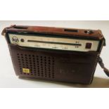 ELVIS OWNED RADIO. An RCA transistor radio in a brown leather carry case, gilt stamped 'E.A.P.